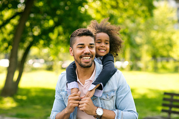 father and child at the park