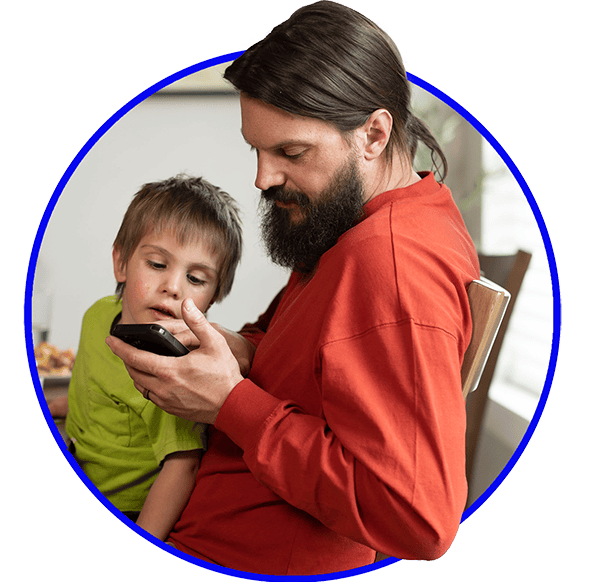 Man and child looking at the smartphone