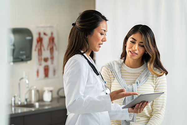 patient reviewing test results with doctor
