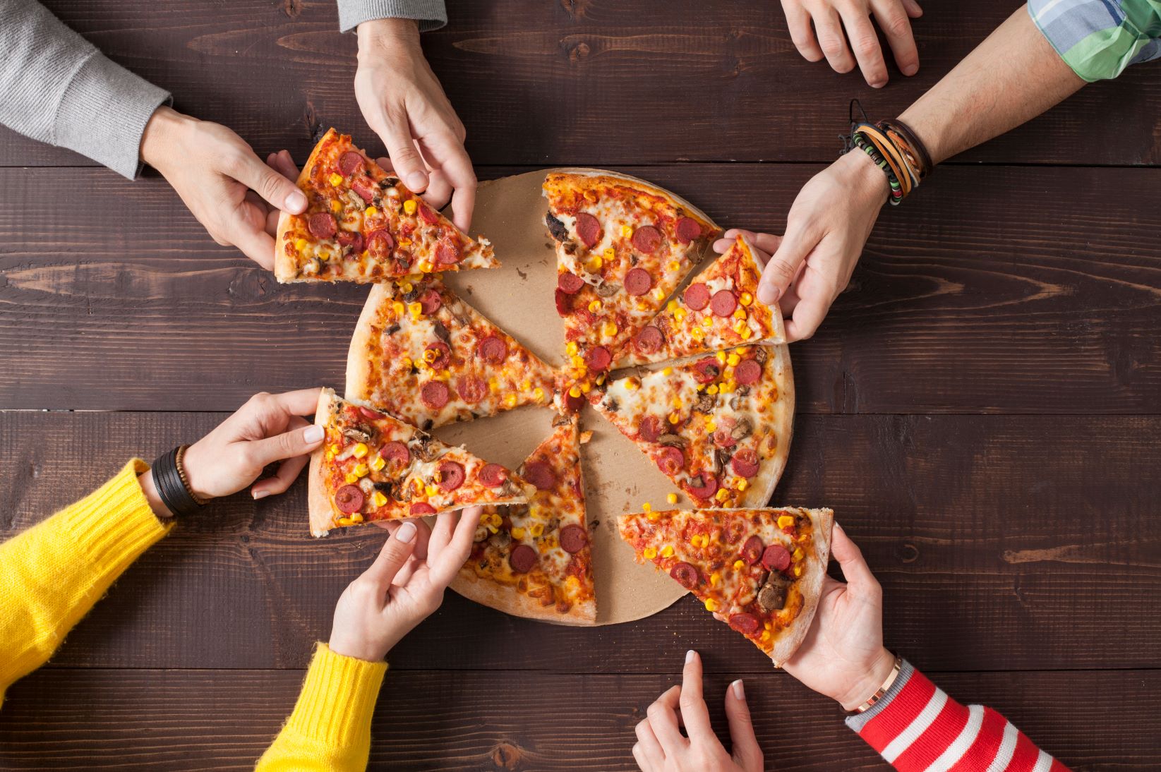 friends sharing a pizza