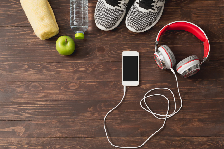 Smartphone with headphone, shoes, water bottoms, apple and tower